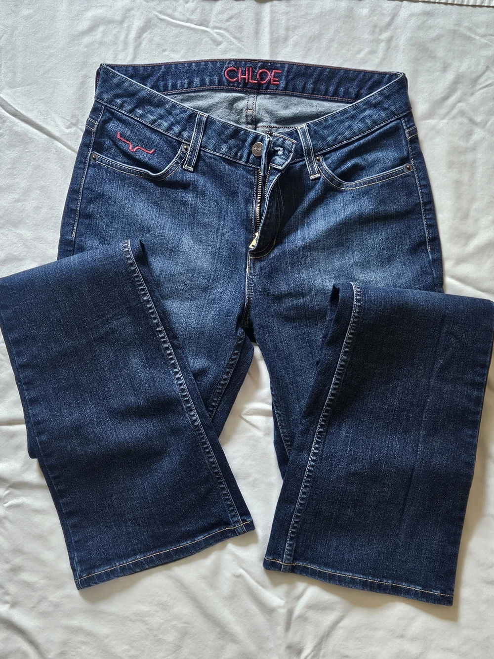 Kimes Ranch Women’s Dark Blue Boot Cut Jeans with Pink Accent